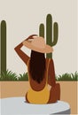 brunette girl in a hat sunbathes in the open air around the vegetation and cacti